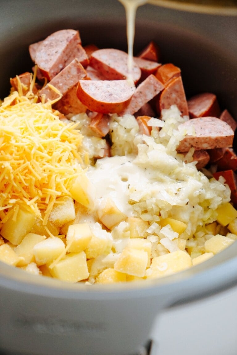 hashbrowns, cheese, onion and smoked sausage in crockpot