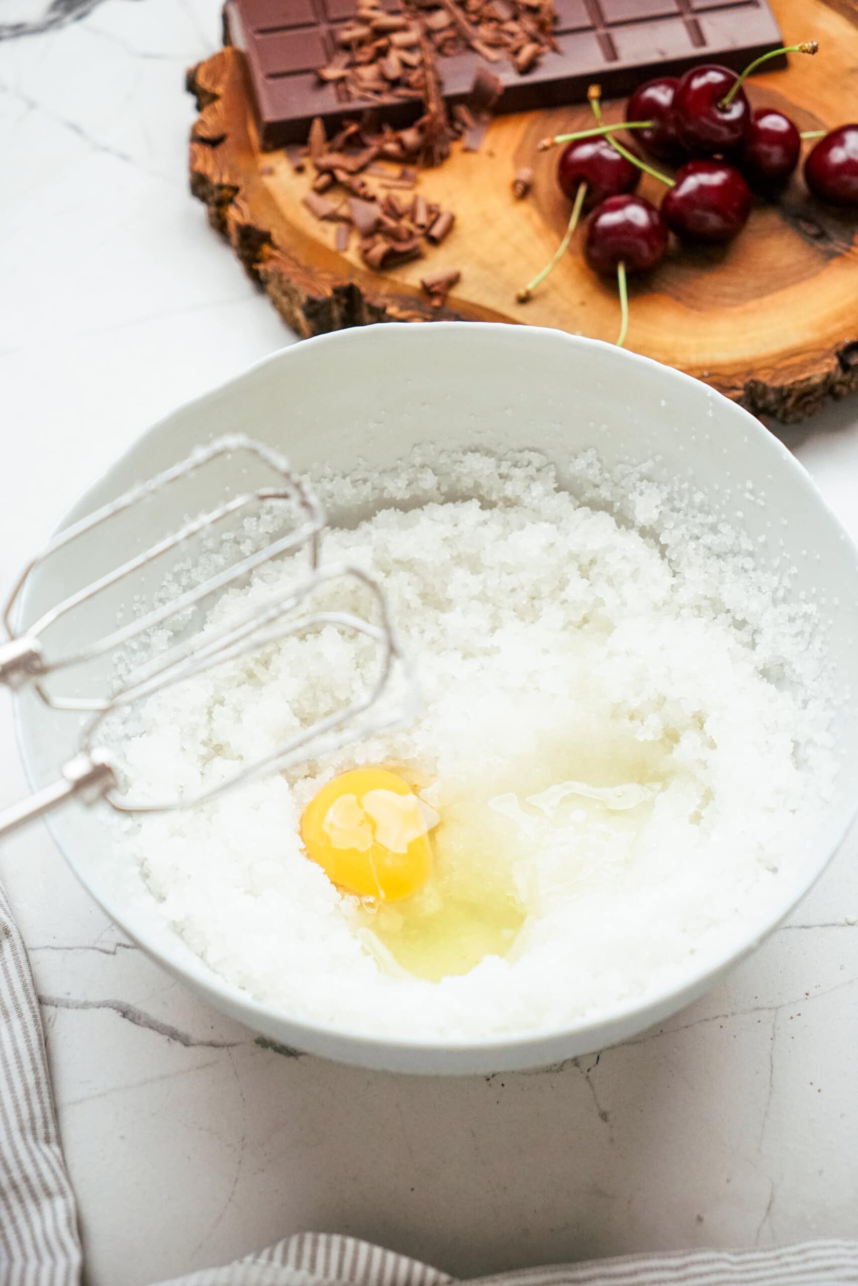 sugar and eggs being whisked together with hand mixer