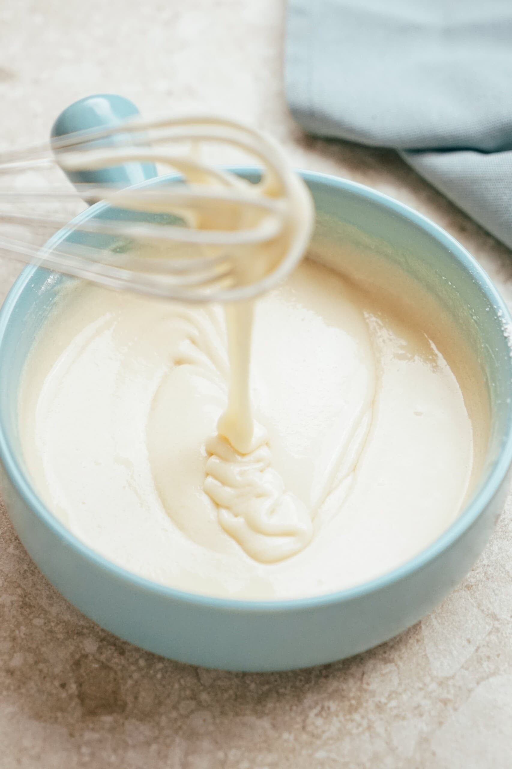 perfect consistency icing in a bowl with a whisk