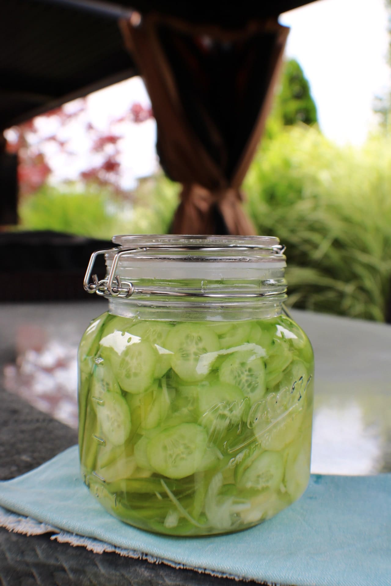 Cucumber Salad in jar on outside table