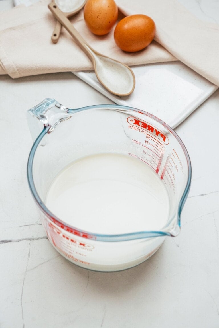 milk in a glass measuring cup