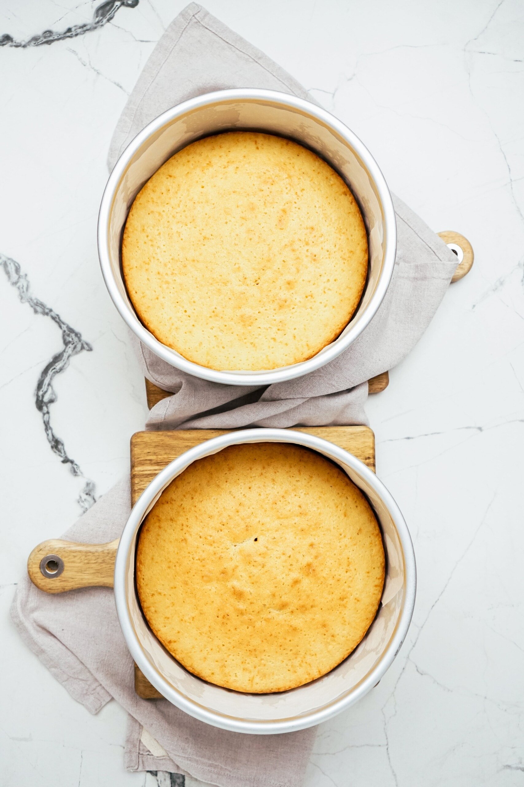 baked vanilla cake cooling in pans