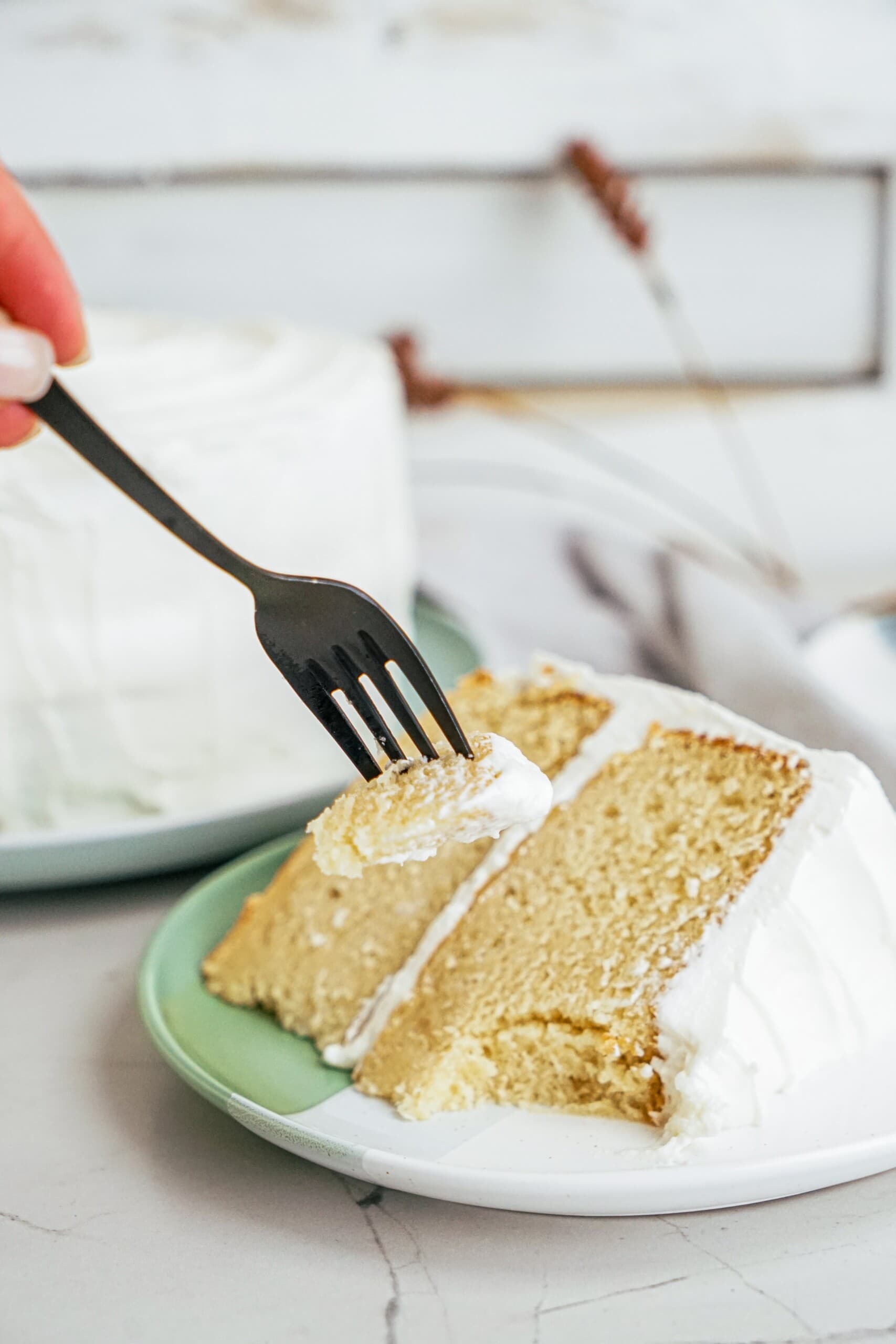 slice of cake on a plate with a fork