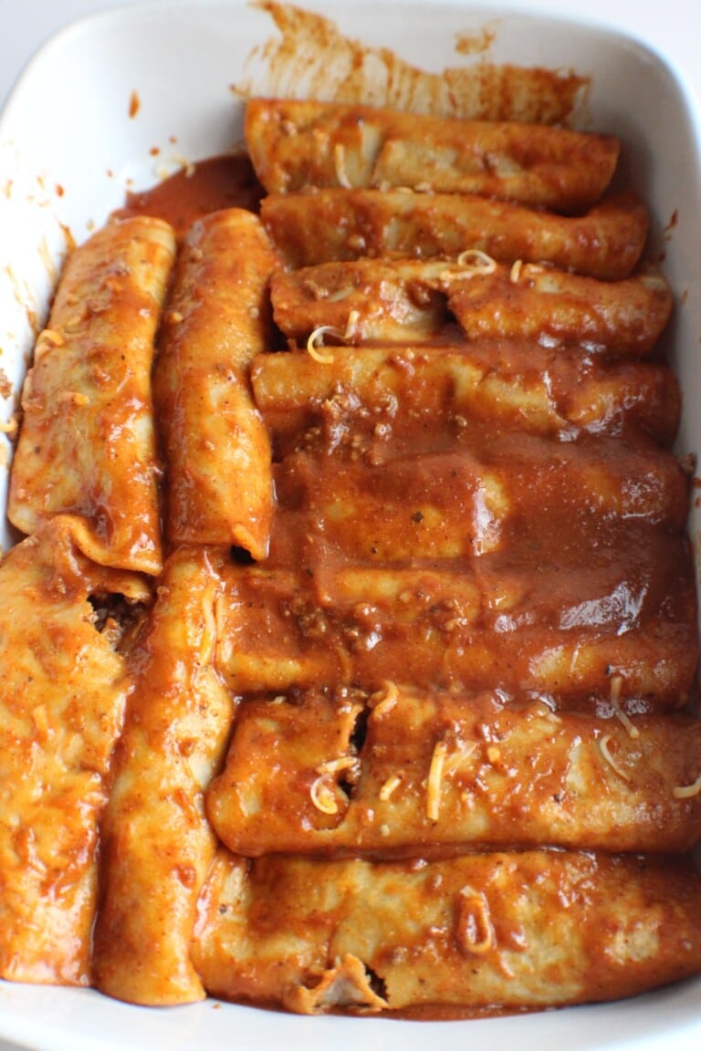 rolled up enchiladas in a pan