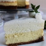 Vanilla Bean Cheesecake with cut piece on plate