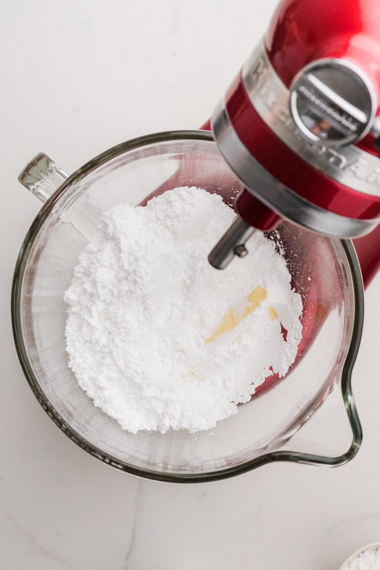 frosting ingredients in a stand mixer bowl