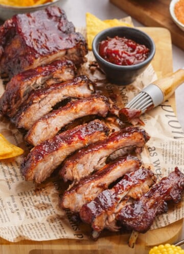 oven baked ribs sliced on serving board
