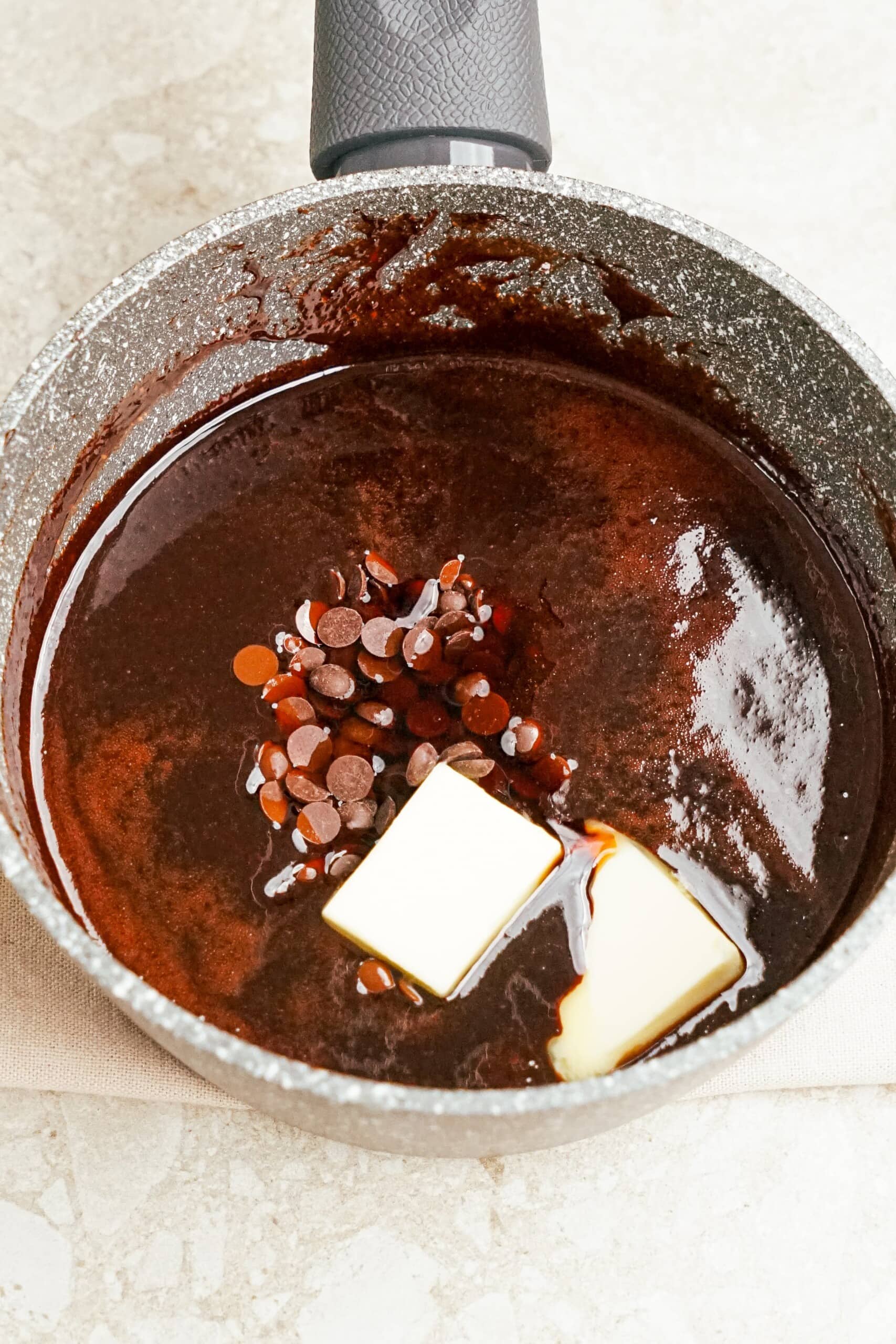 butter added to hot fudge mixture in a saucepan