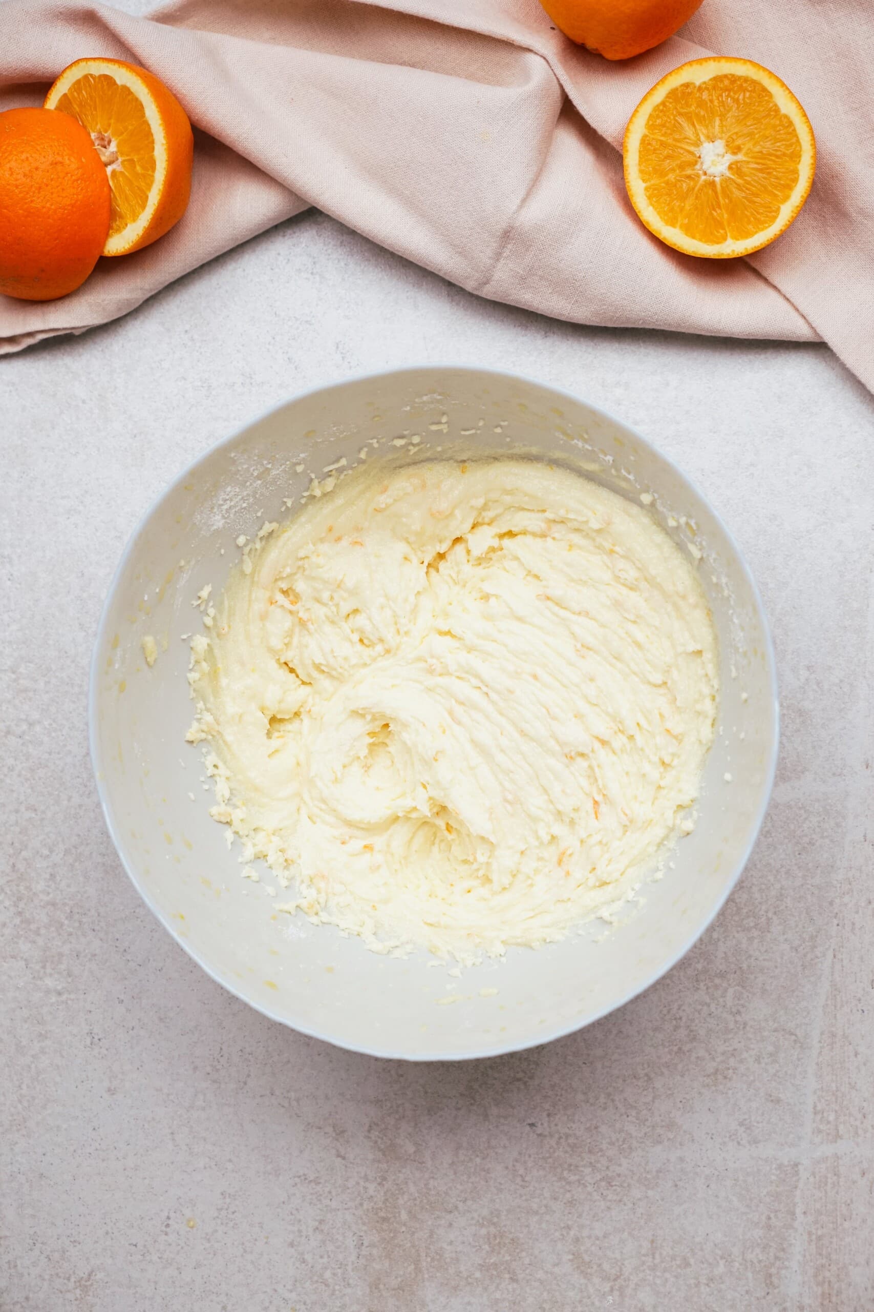 orange frosting in a mixing bowl