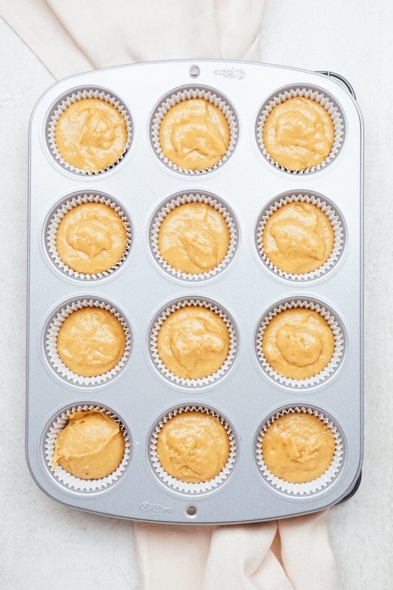 sweet potato cupcake batter in muffin tins