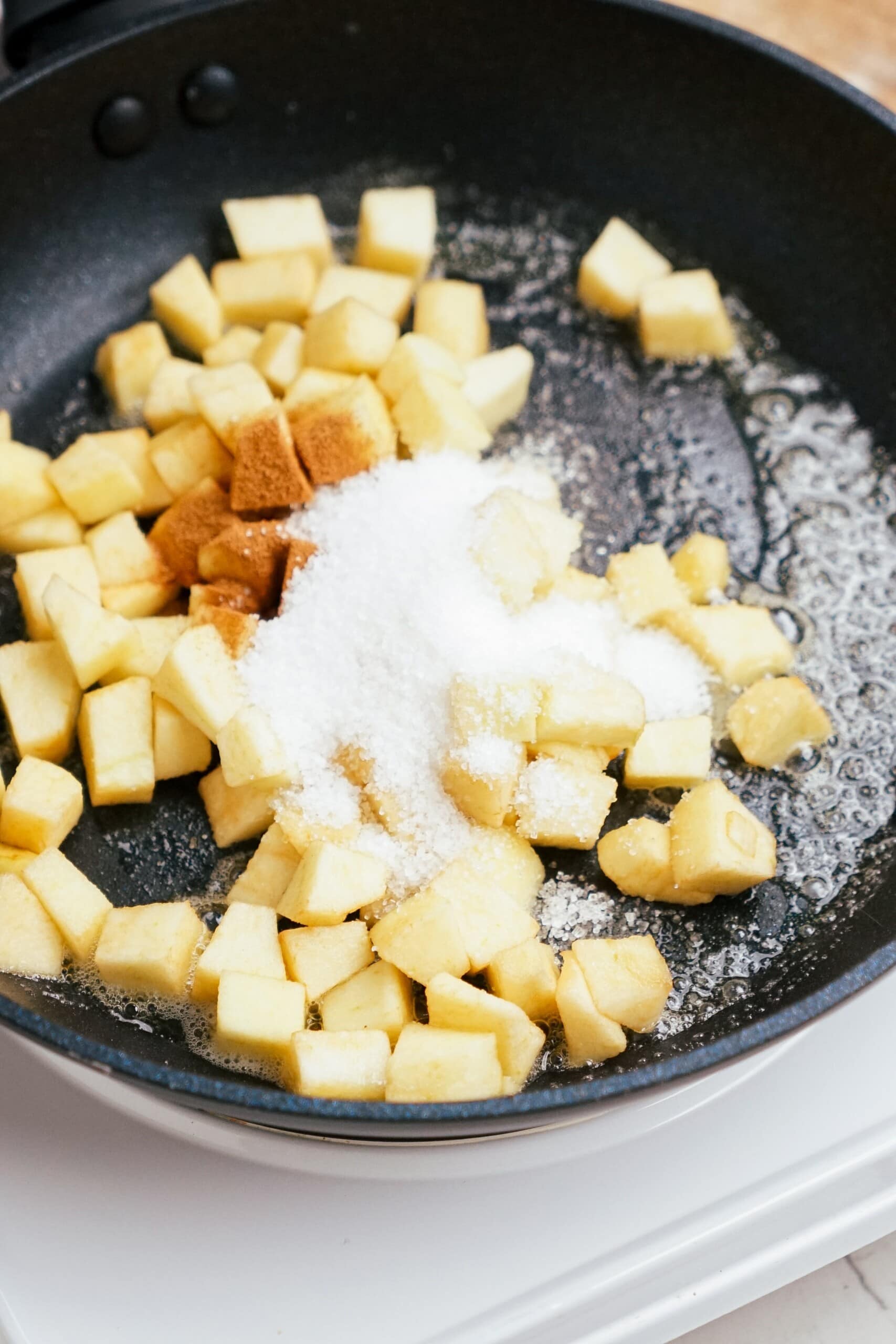 diced apples, cinnamon and sugar in a skillet