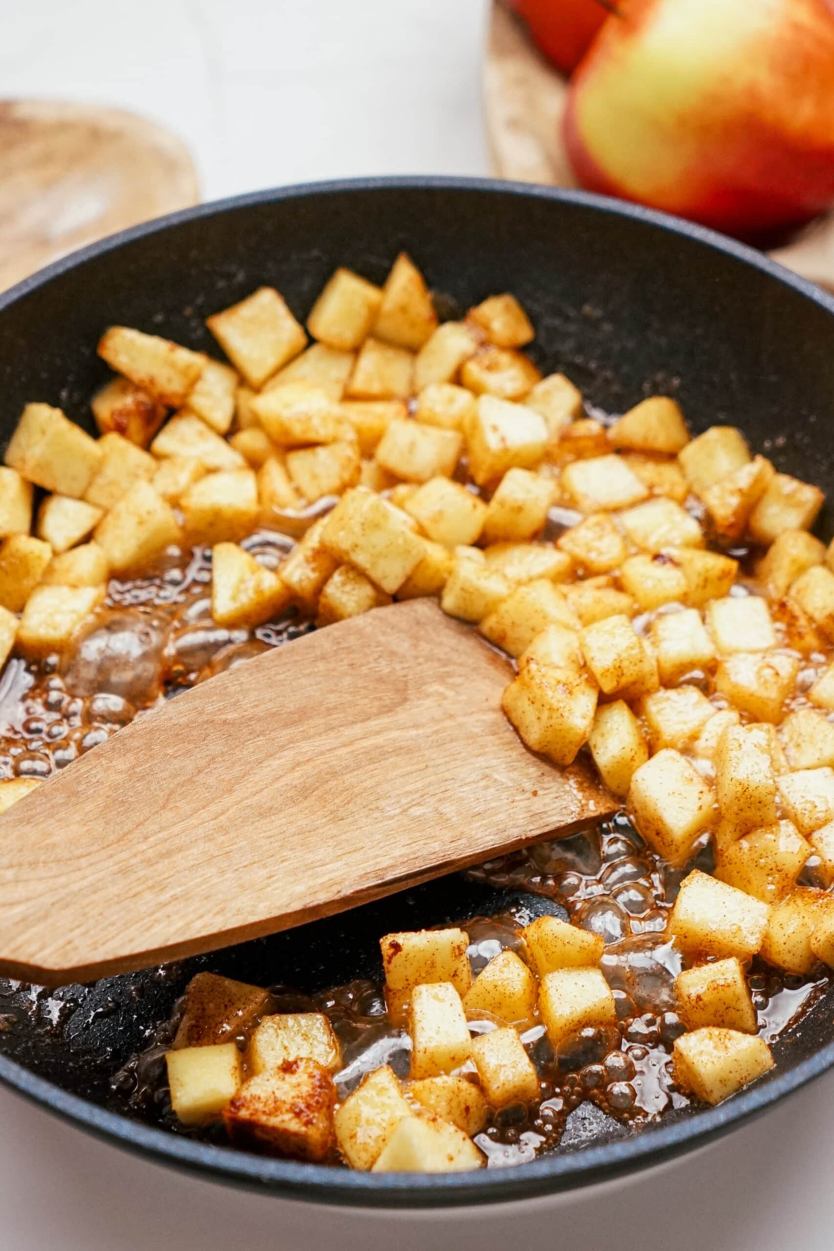 diced apples with  cinnamon in a skillet