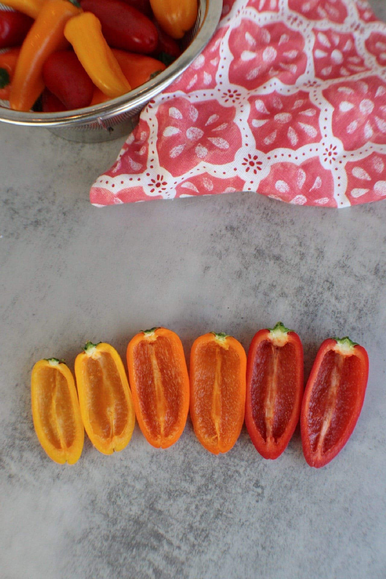 mini peppers sliced in half lengthwise with seeds removed