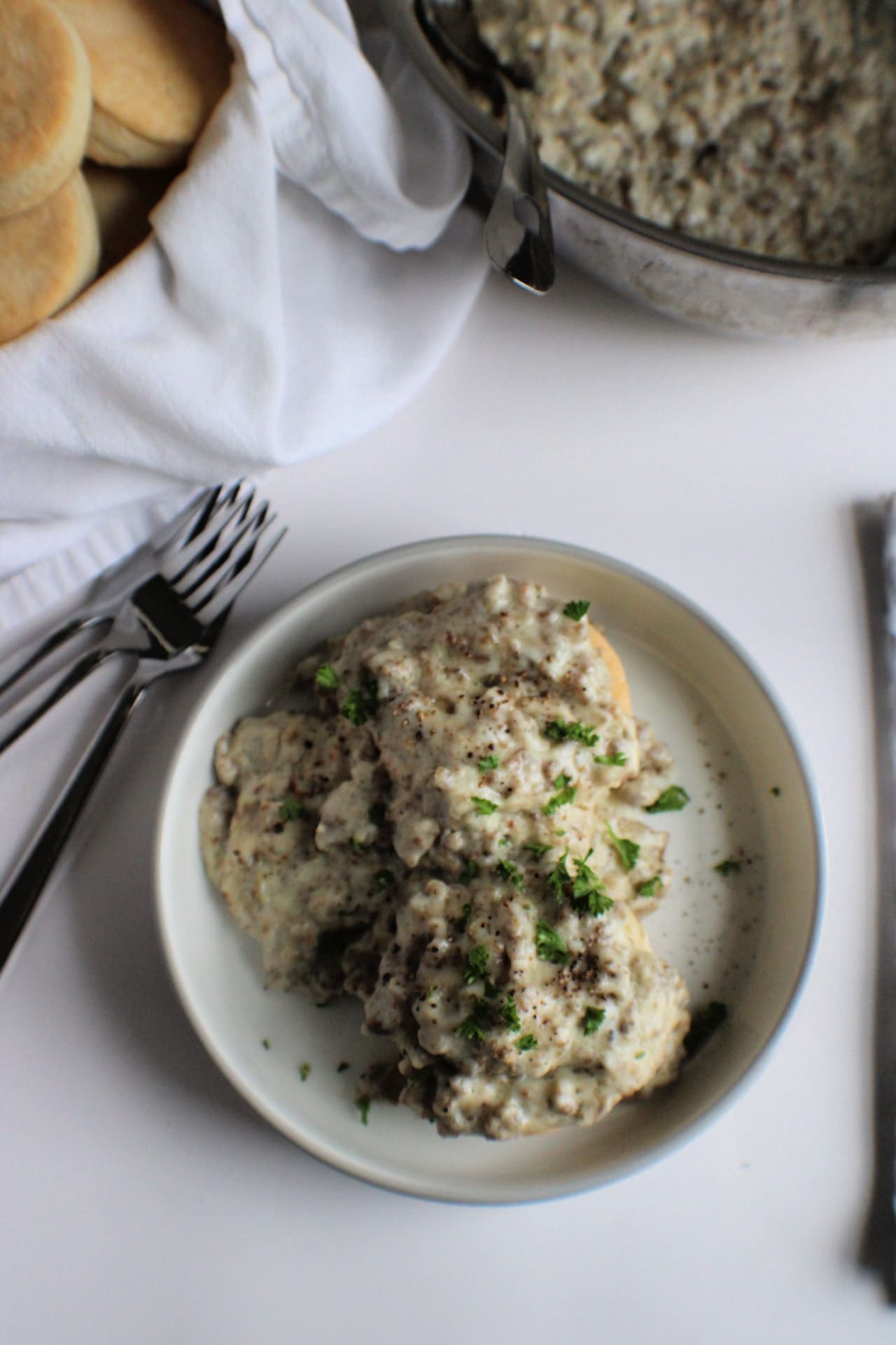 Sausage Biscuits & Gravy on a plate and tablescape