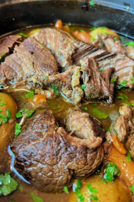 tender roast in a pot with veggies and potatoes