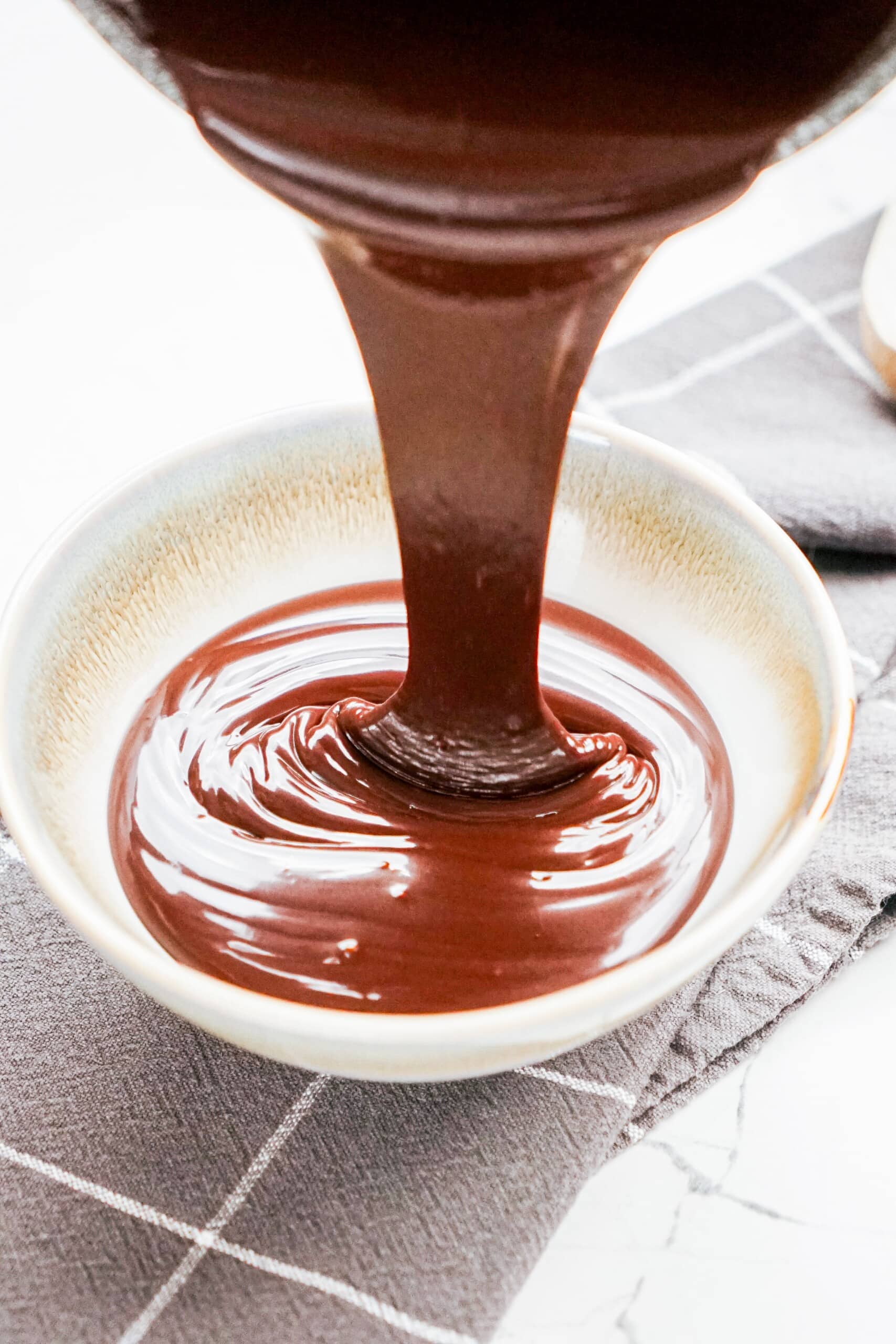 dipping chocolate being poured into a bowl