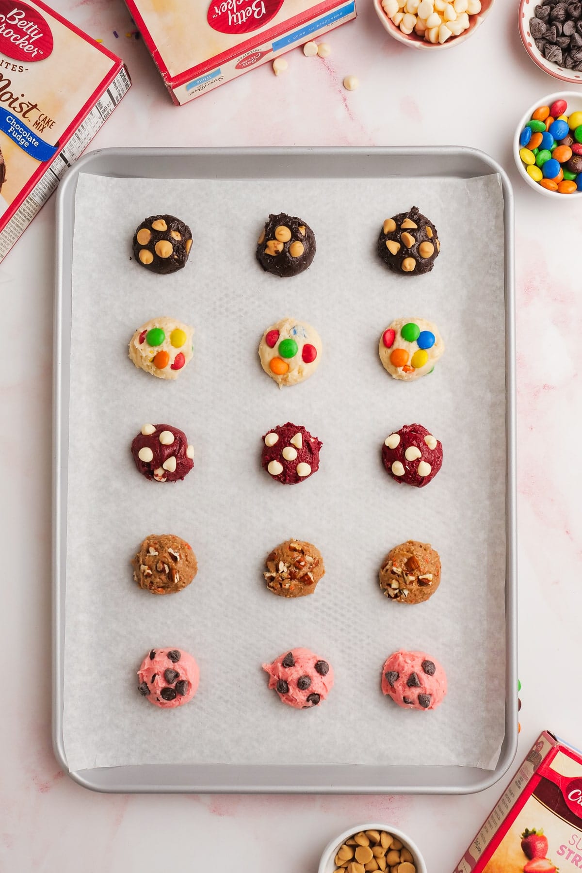 cake mix cookie dough in balls on a baking sheet