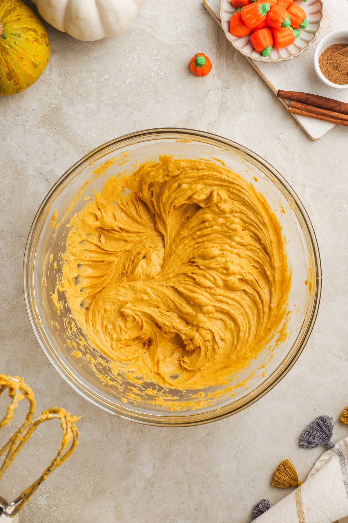 smooth pumpkin dip in a glass mixing bowl