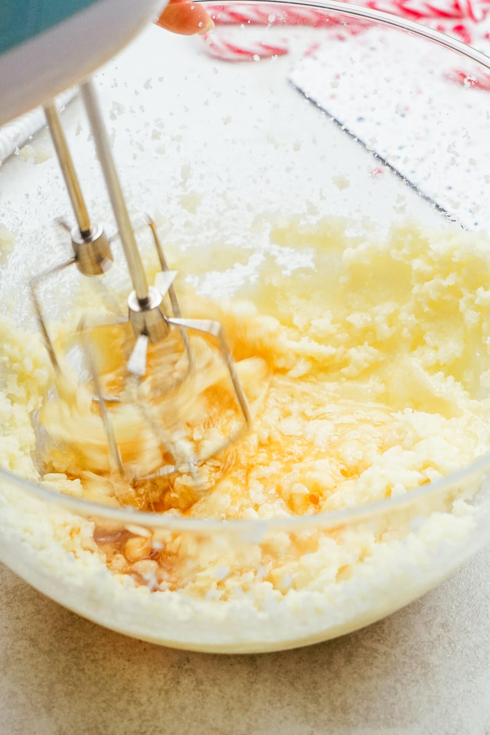electric mixer combing the egg into dough mixture