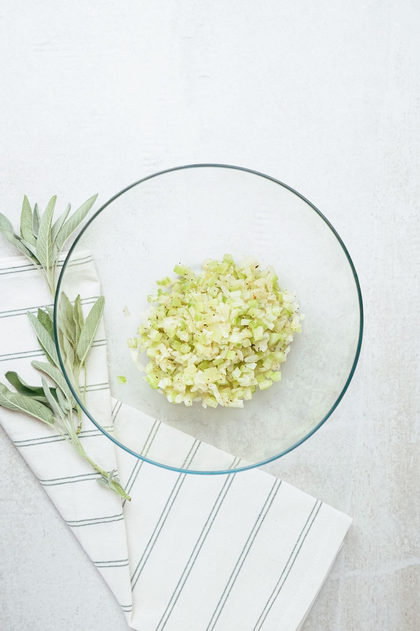 diced celery and onions in a glass bowl