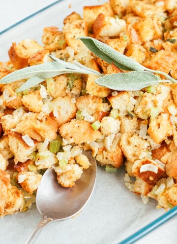 close up of stuffing in a pan with serving spoon
