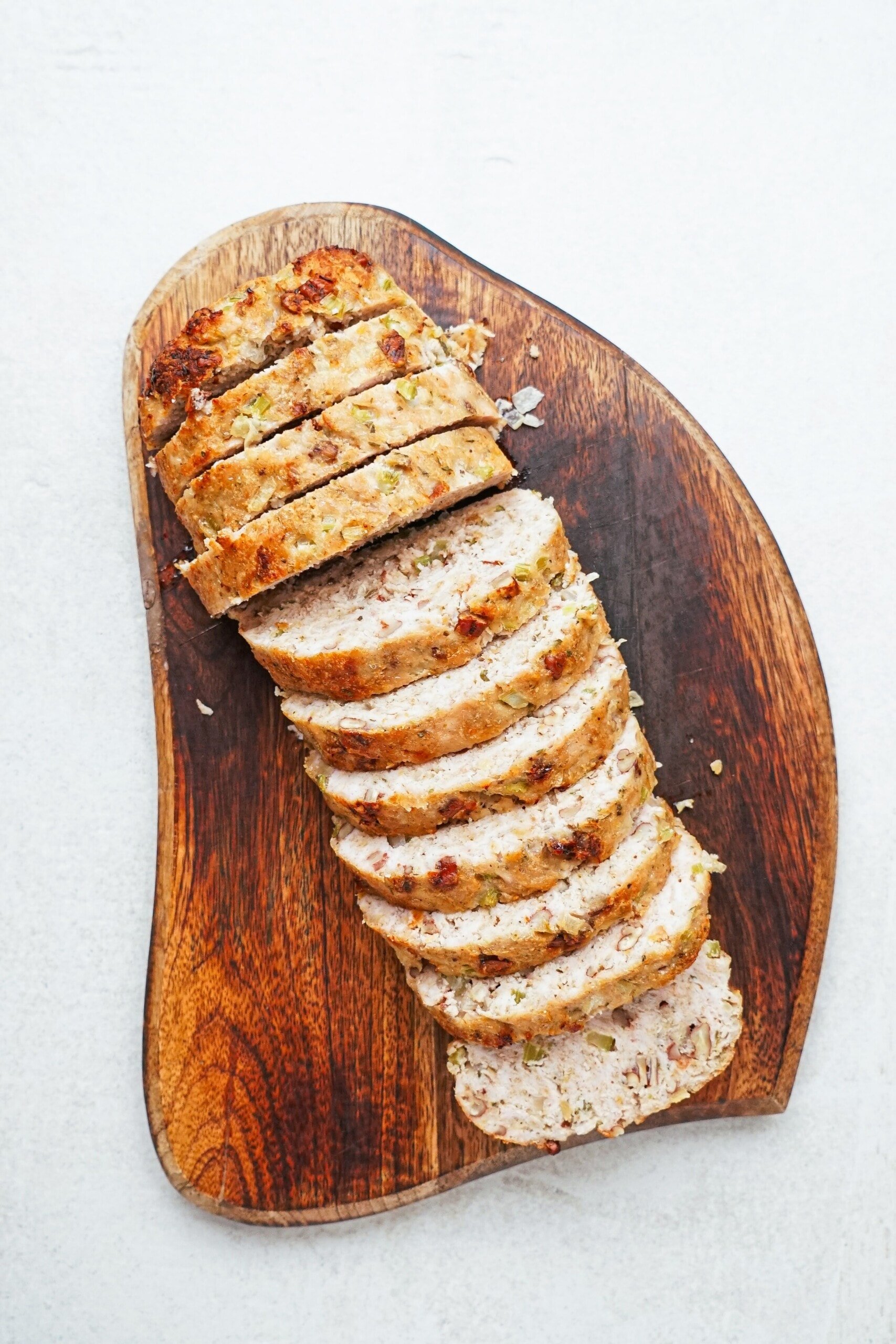 sliced turkey meatloaf on a cutting board