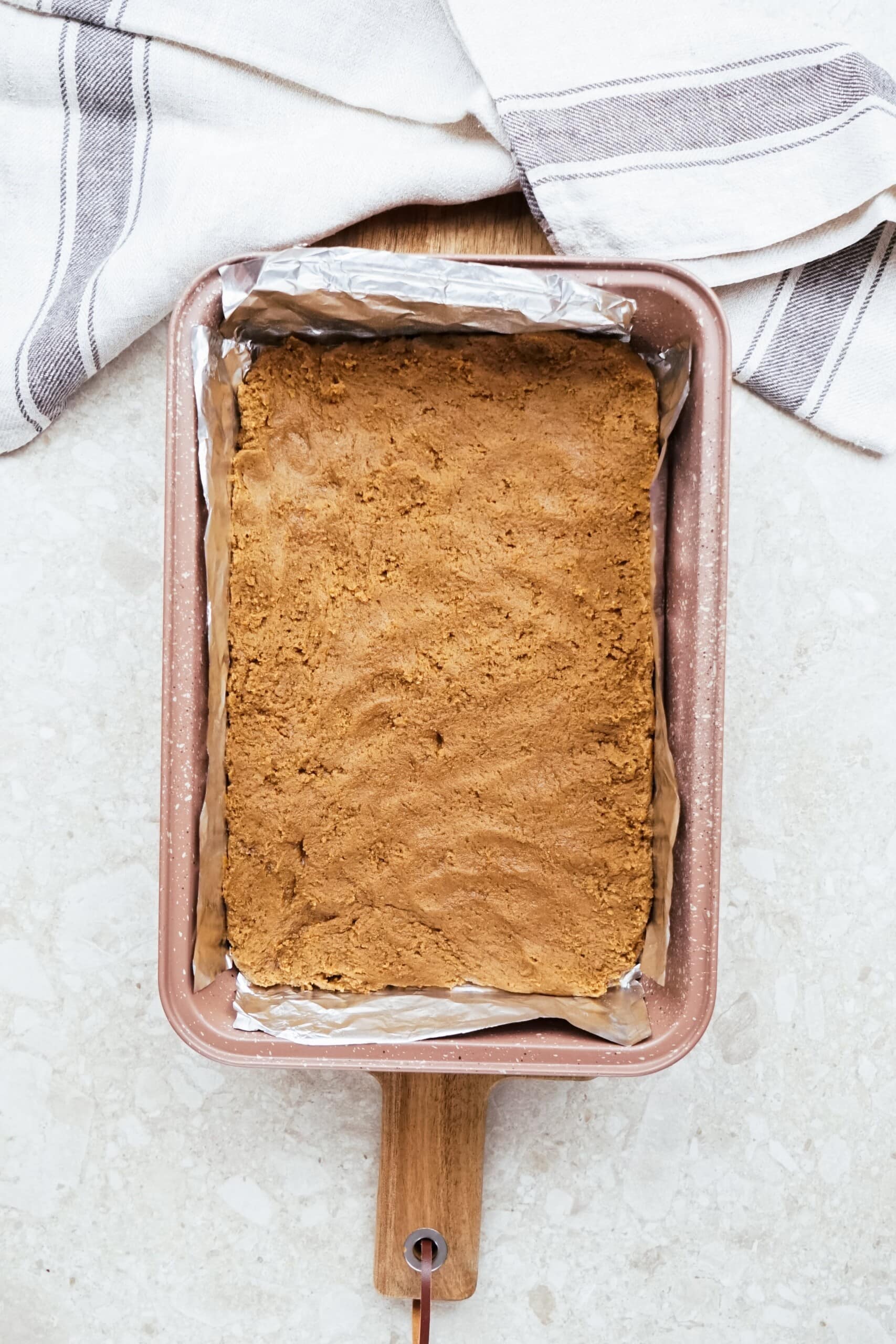 gingerbread dough in a pan spread out
