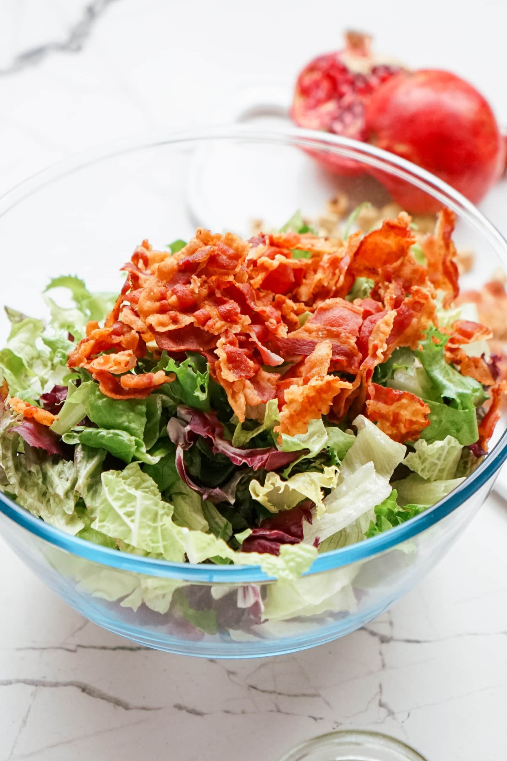 bacon added to salad bowl