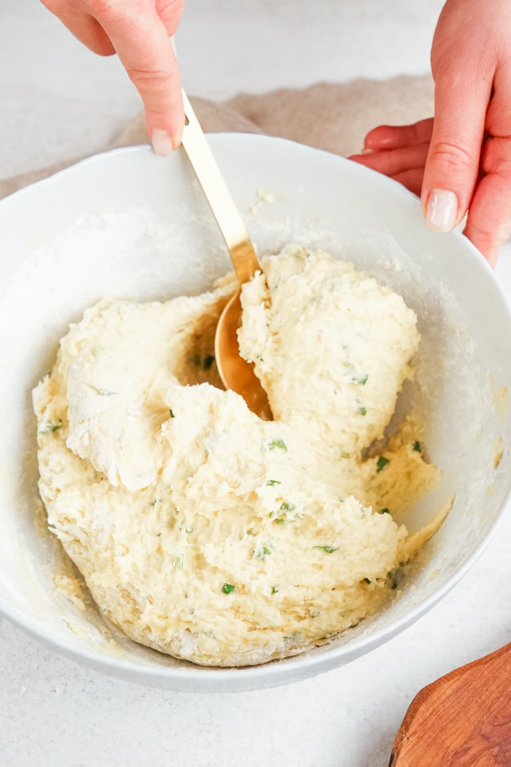 large spoon scooping mashed potatoes