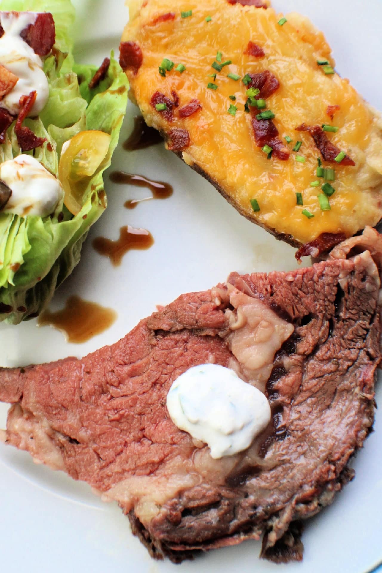 slice of Smoked Prime on plate with side dishes