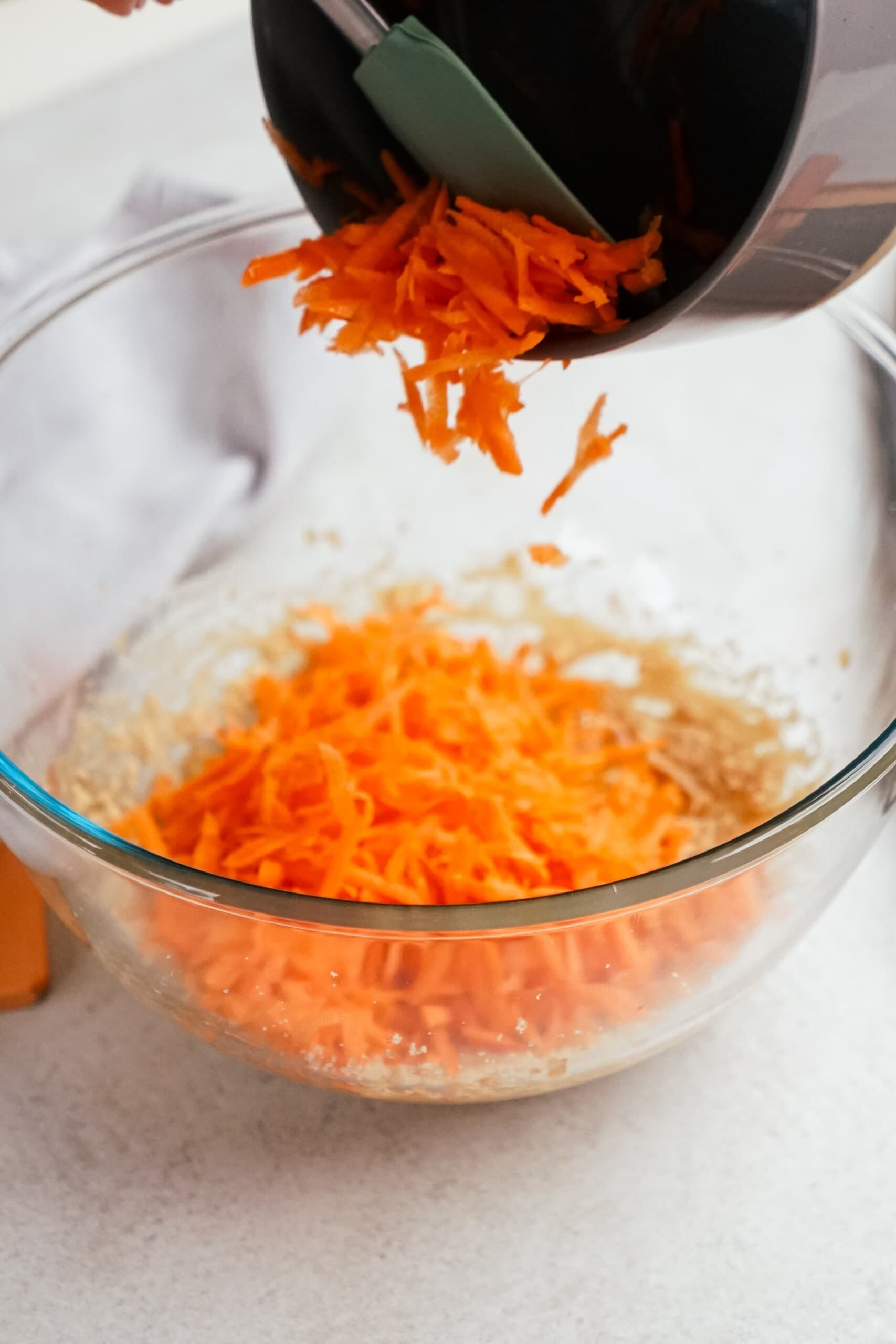shredded carrots added to cookie mixture
