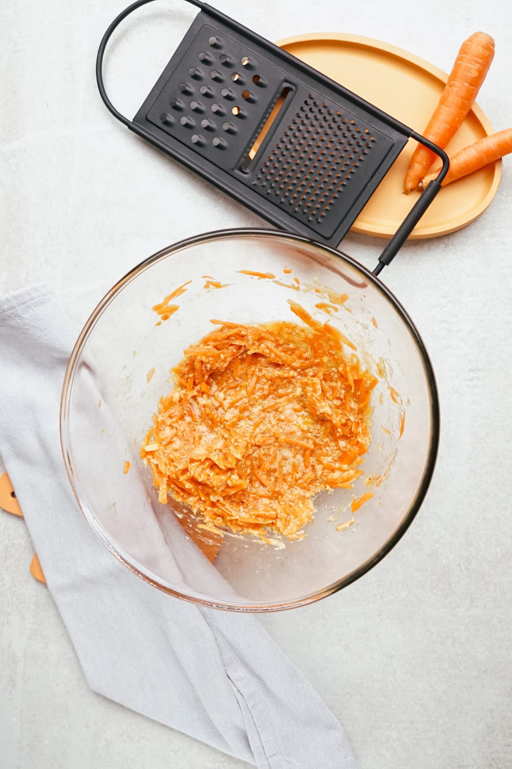 shredded carrots added to sugar mixture