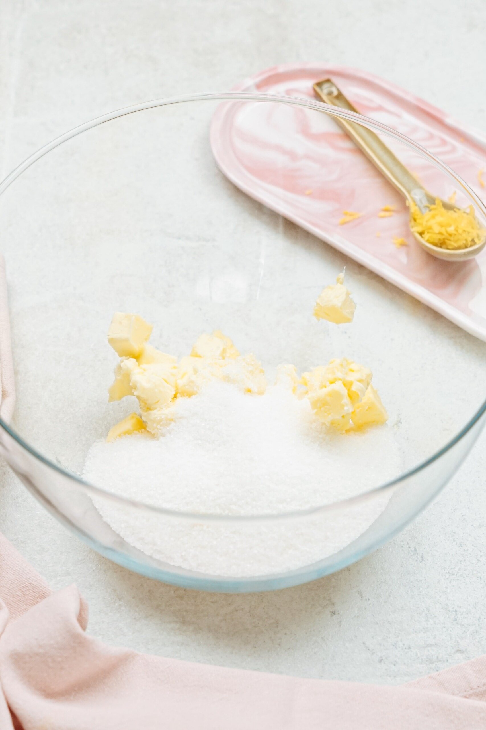 butter cubes and sugar in a glass bowl