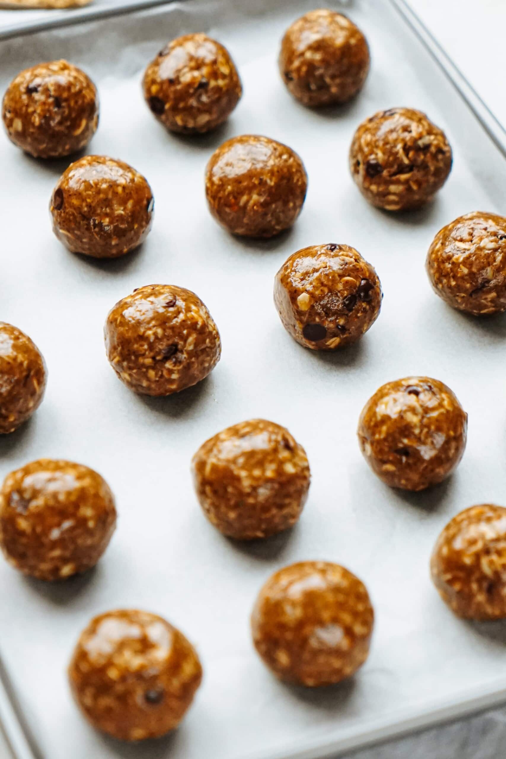 peanut butter energy balls on a baking sheet