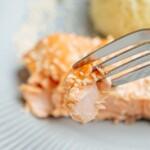 A fork is used to eat salmon.
