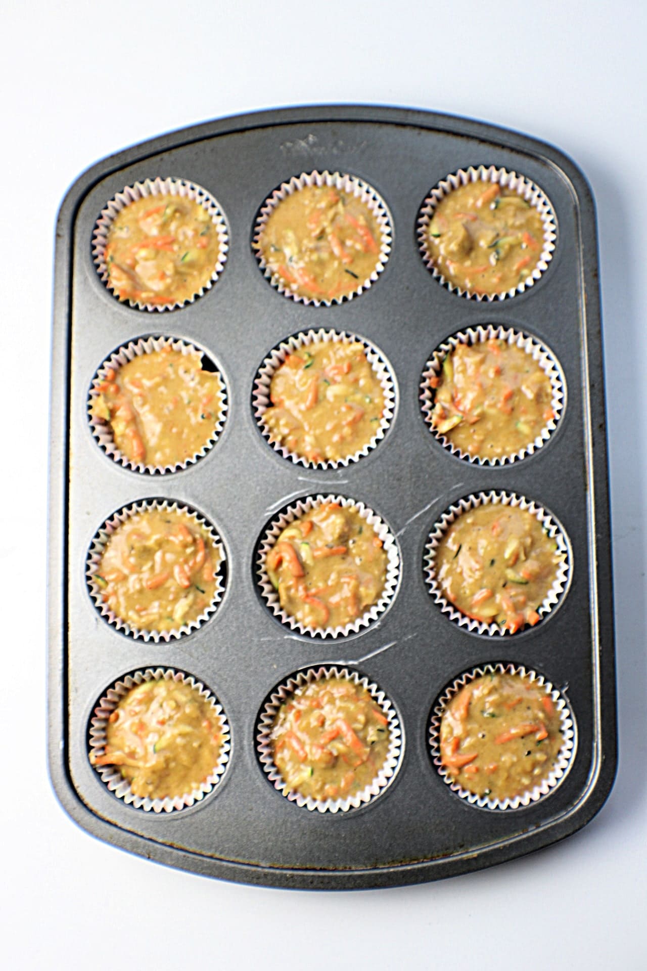 Morning Glory Muffins batter in muffin pan