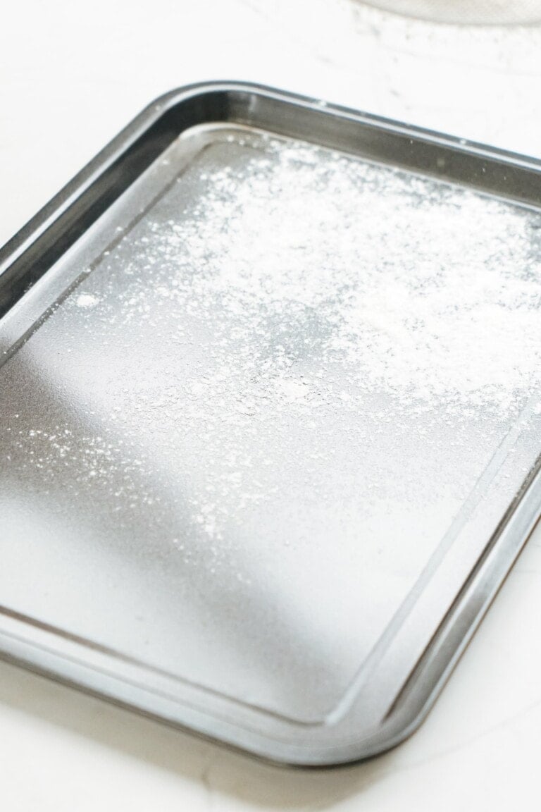 A baking sheet with flour on it.
