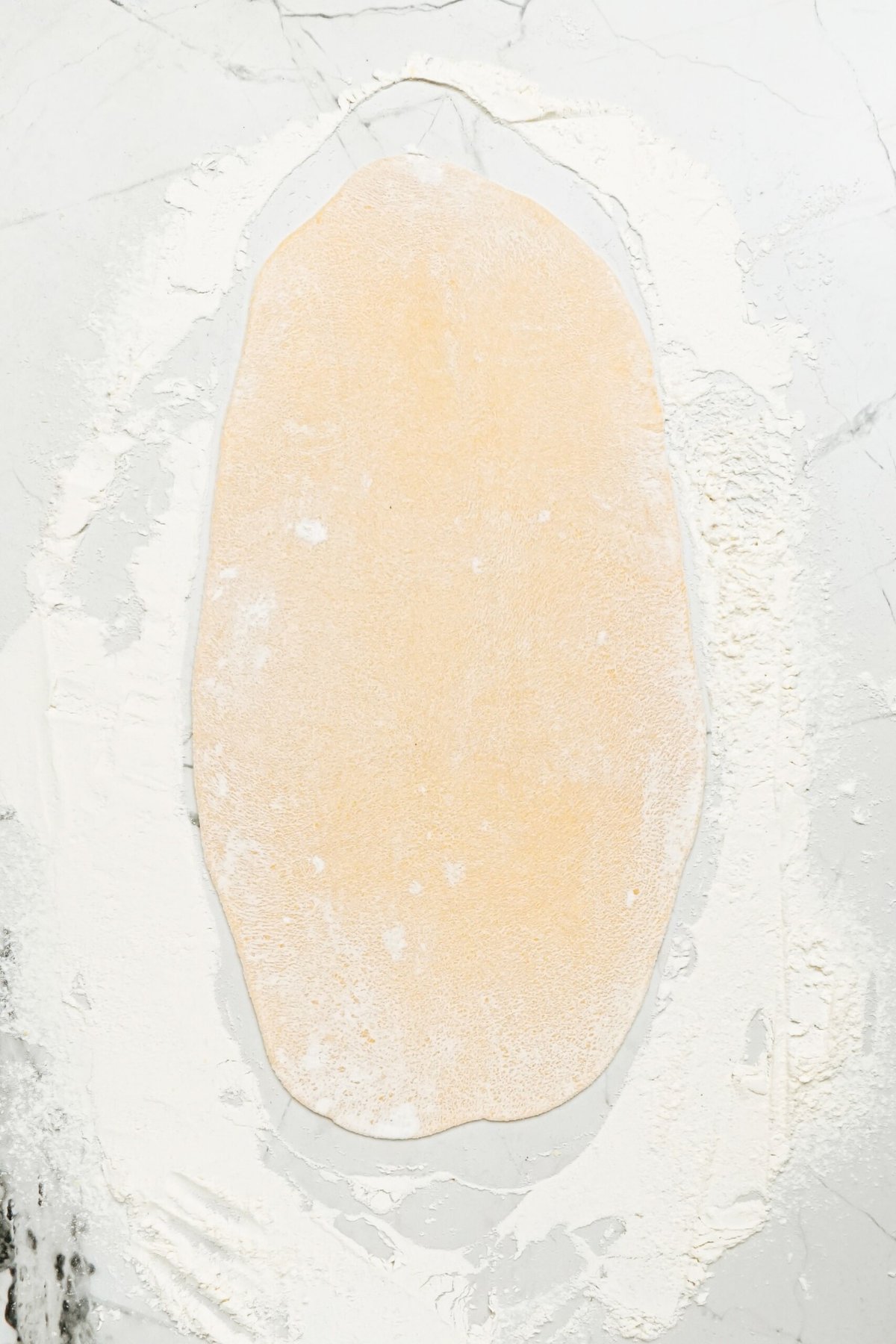 An image of a dough on a white surface.