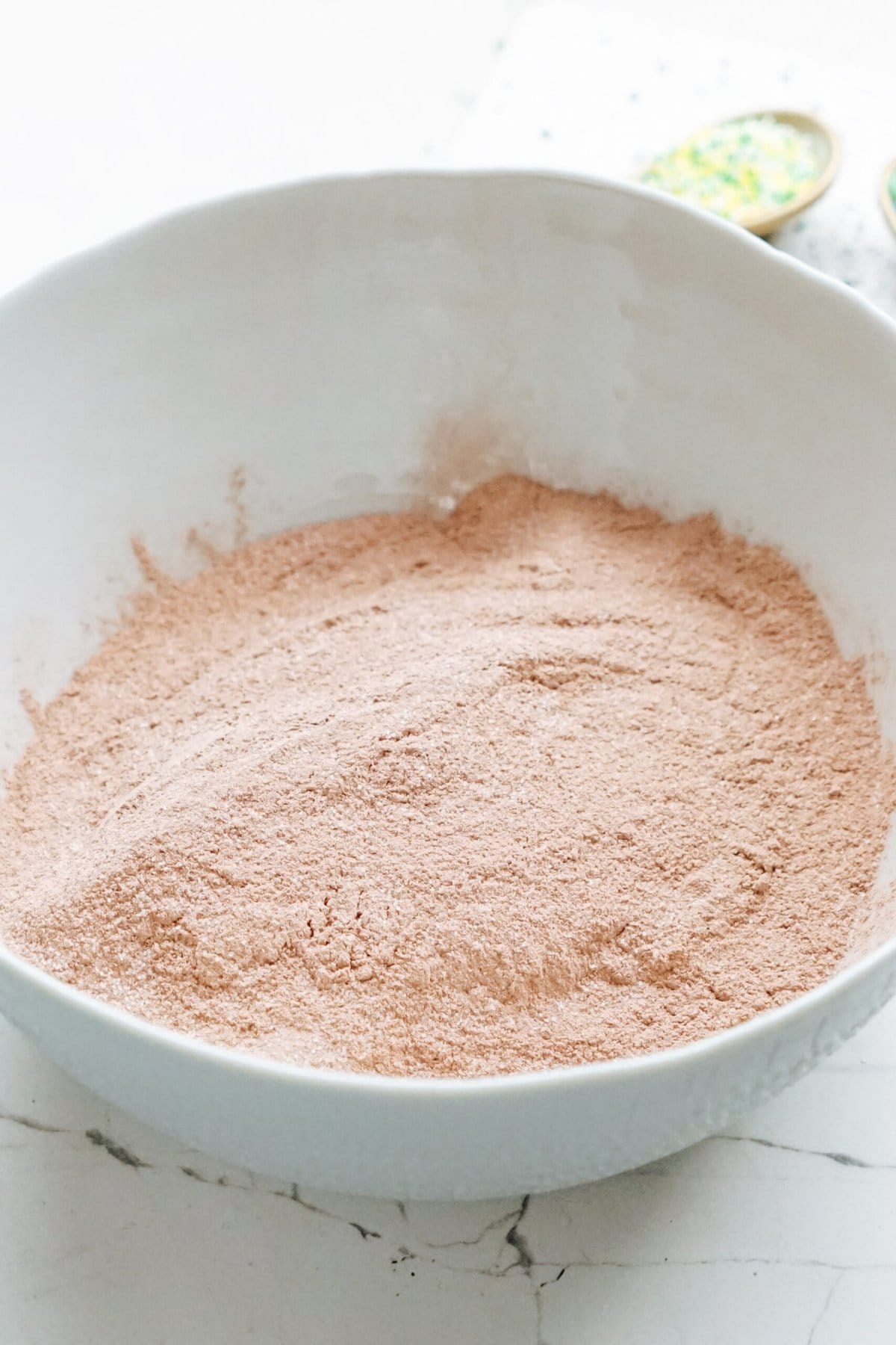 dry cake mix in a white mixing bowl