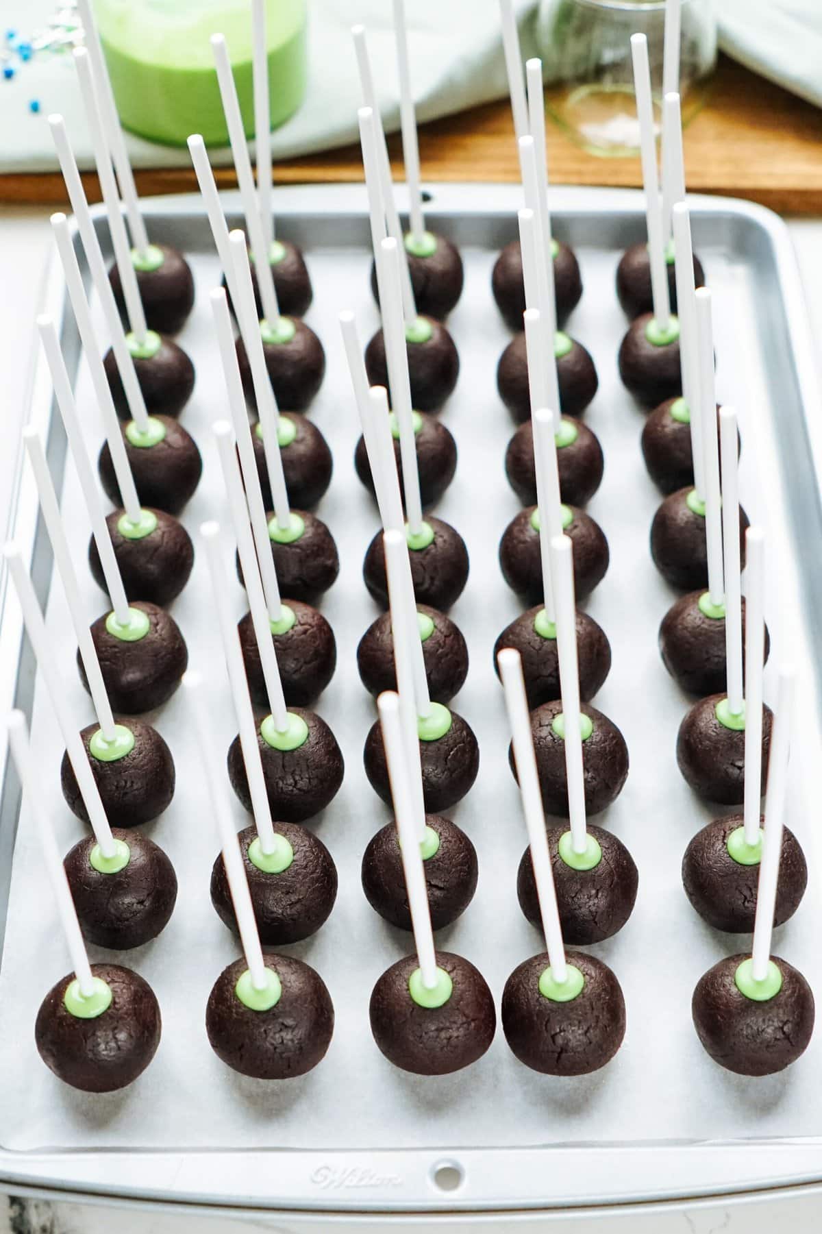 Chocolate cake pops on a tray.