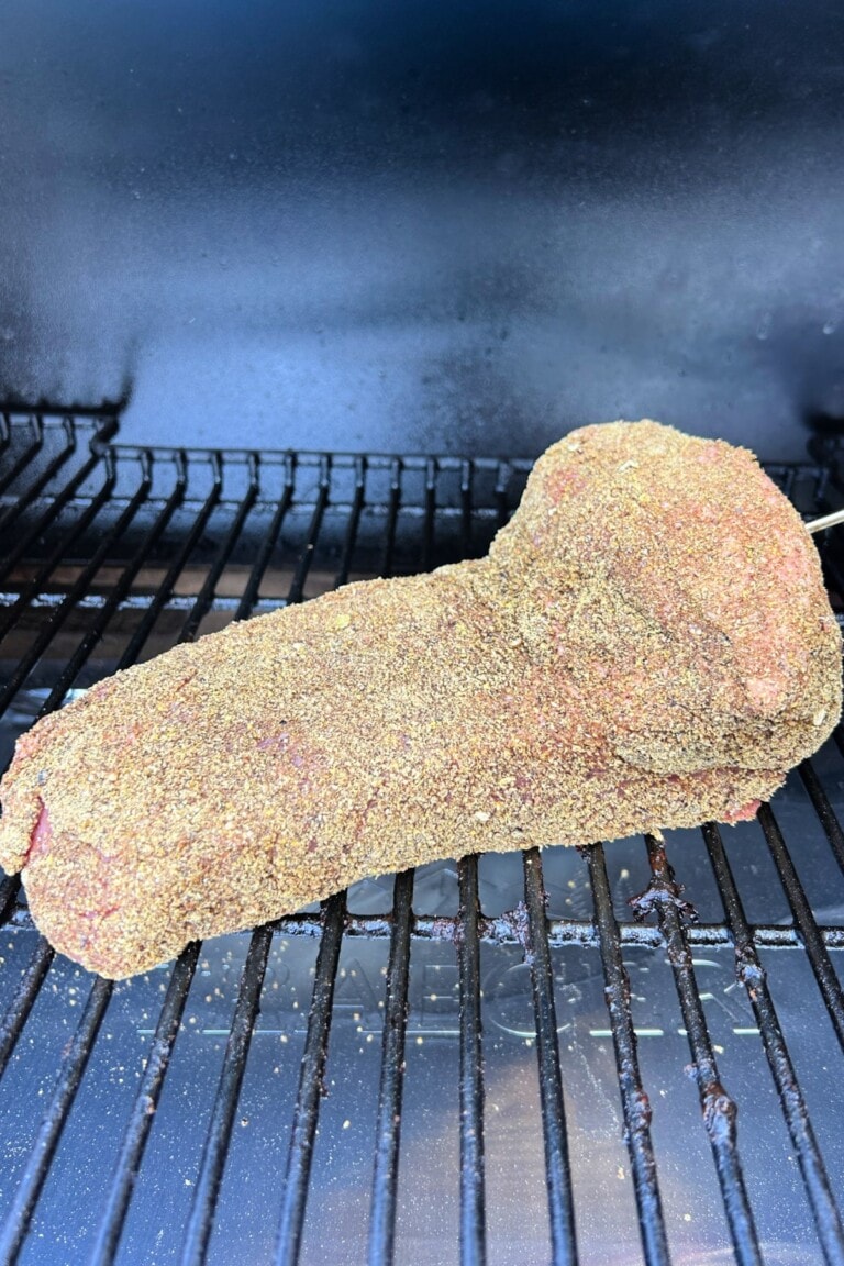 A corned beef recipe sitting on a grill.
