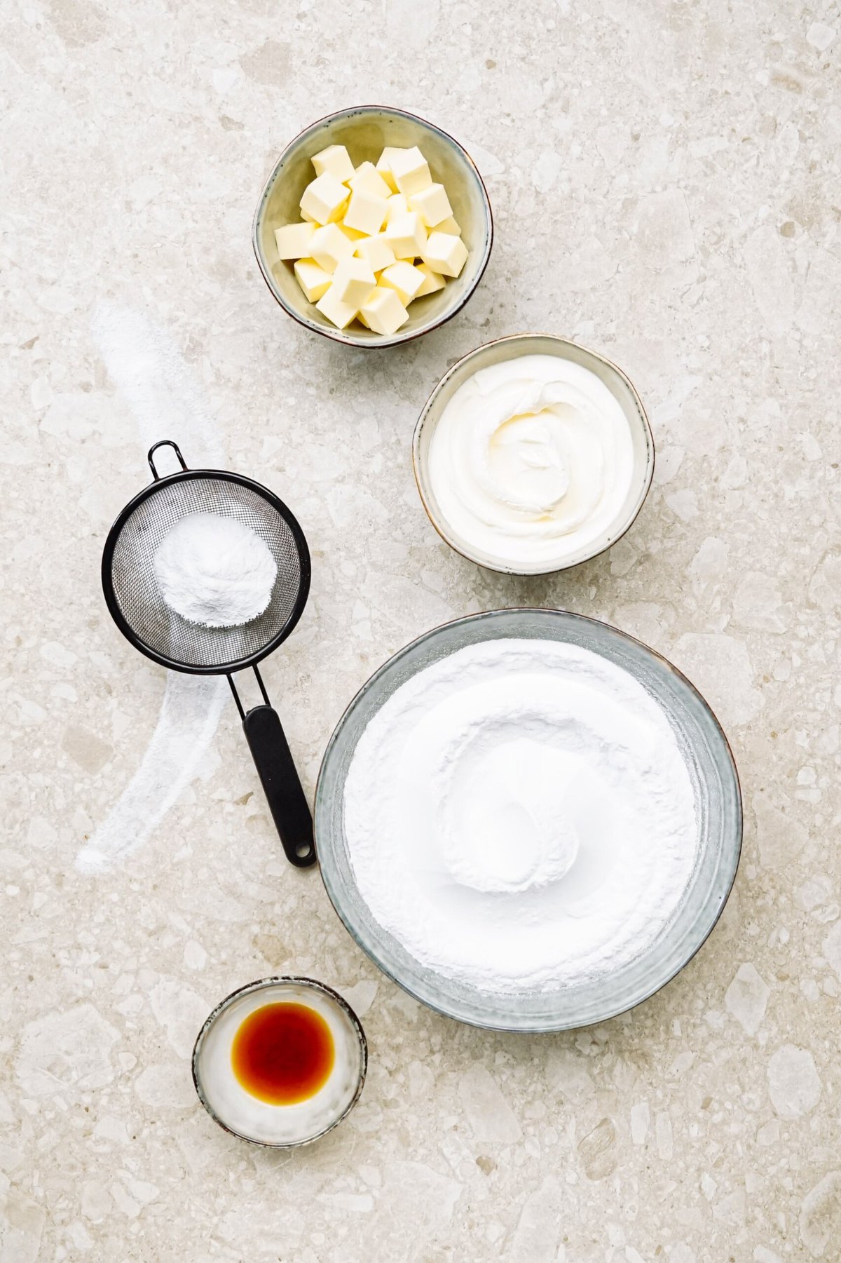 ingredients for cream cheese frosting on a counter top