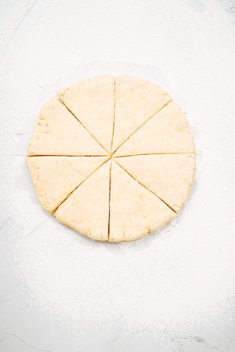 scone dough in a circle and cut into pie pieces