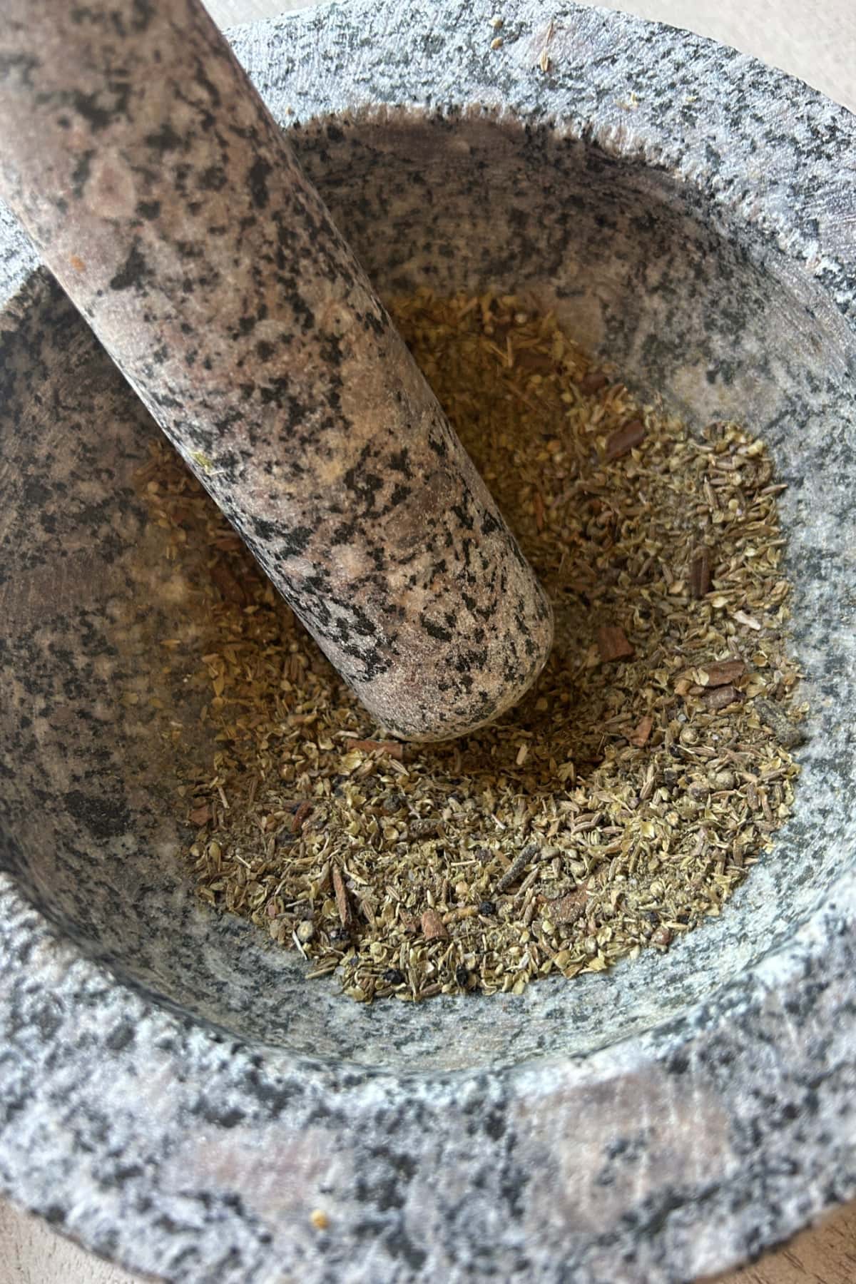 mortar and pestle grinding up spices
