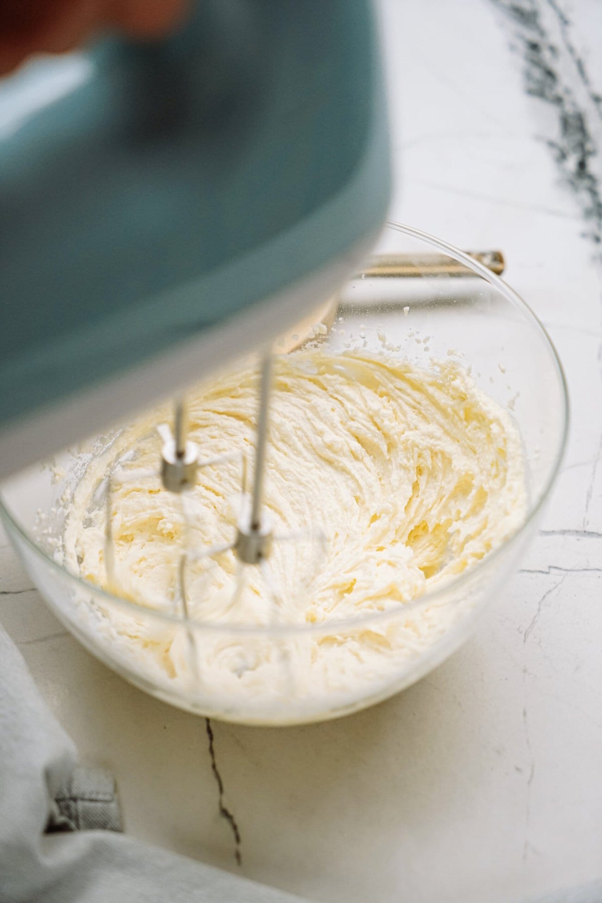 hand mixer whipping frosting ingredients 