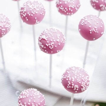 cake pops drying in a cake pop stand