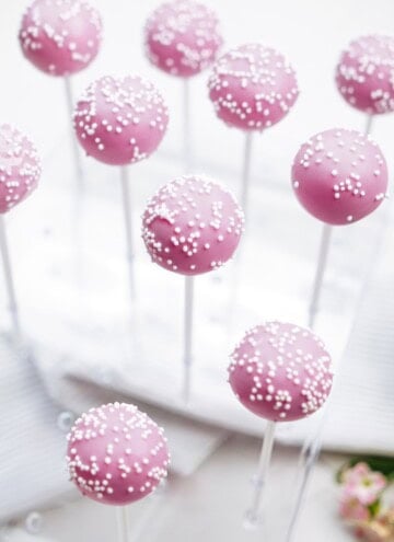 cake pops drying in a cake pop stand