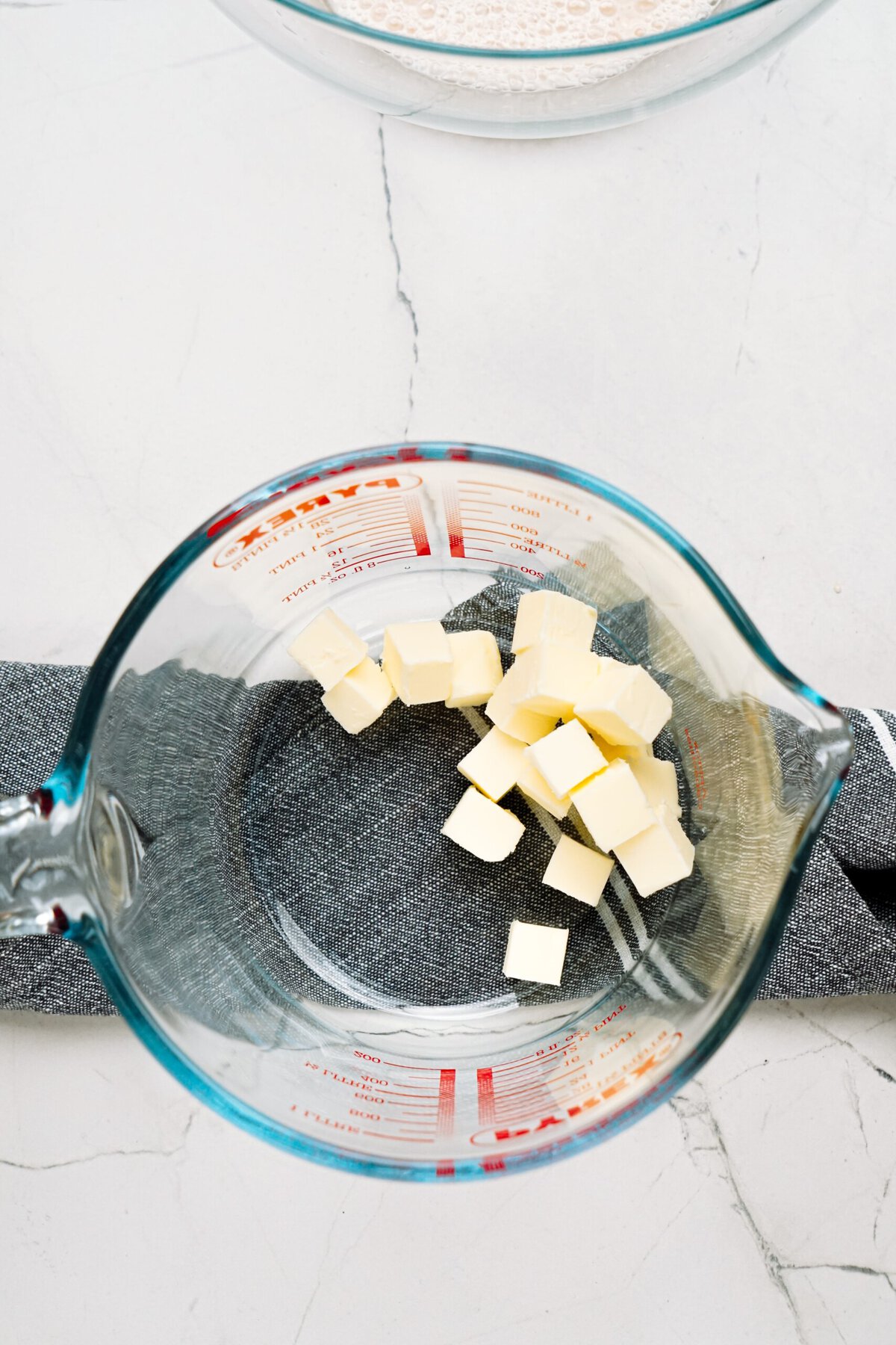 cubes of butter in a glass measuring cup