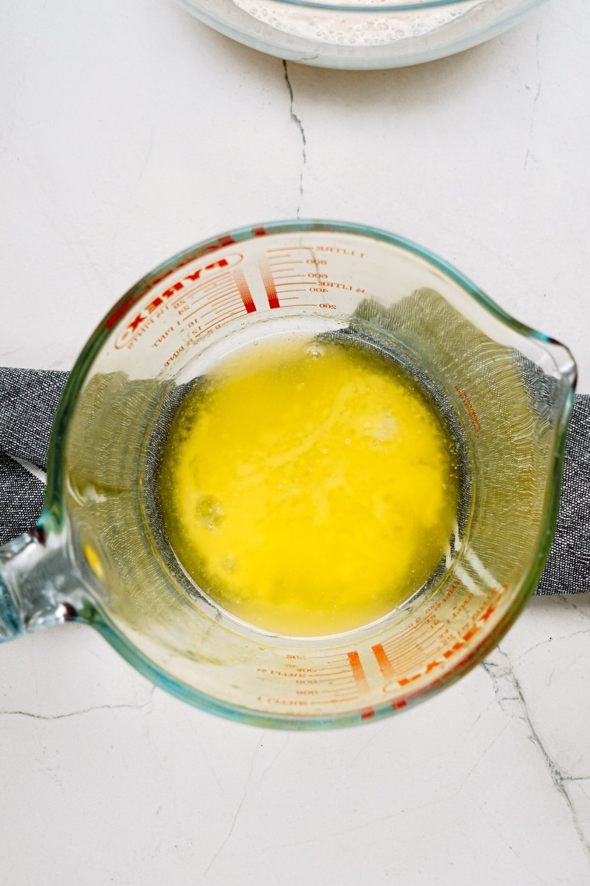 melted butter in a glass measuring cup
