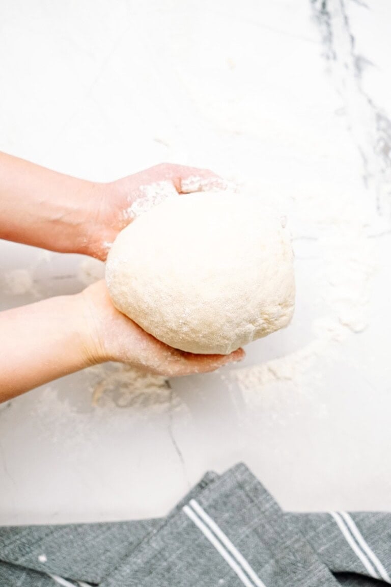 a person holding dough